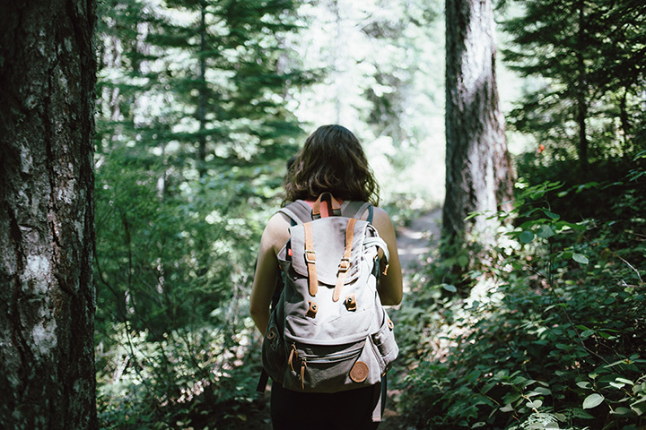 11 Hiking Safety Tips for Your Next Trail Adventure 1 A hiker walks on a trail through the forest