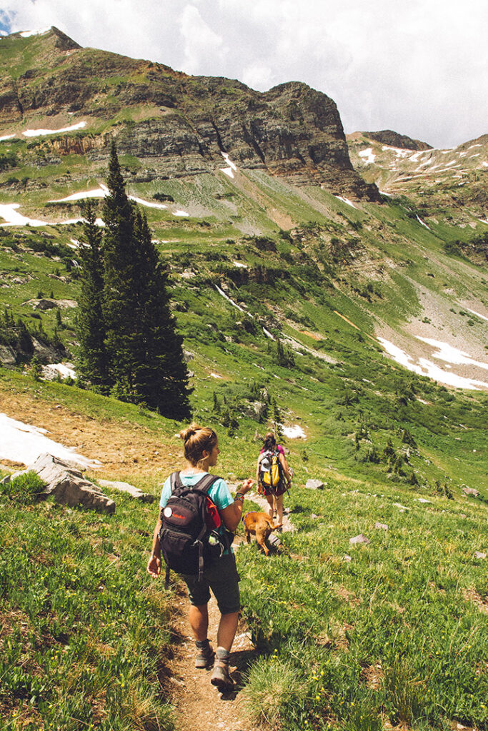 11 Hiking Safety Tips for Your Next Trail Adventure 18 A hiker walks on a trail through the mountains