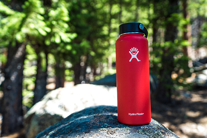 11 Hiking Safety Tips for Your Next Trail Adventure 17 A red water bottle on a rock