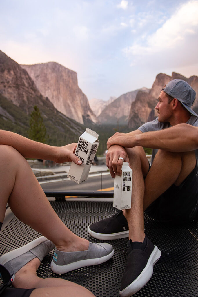 11 Hiking Safety Tips for Your Next Trail Adventure 16 Two hikers take a break and drink water