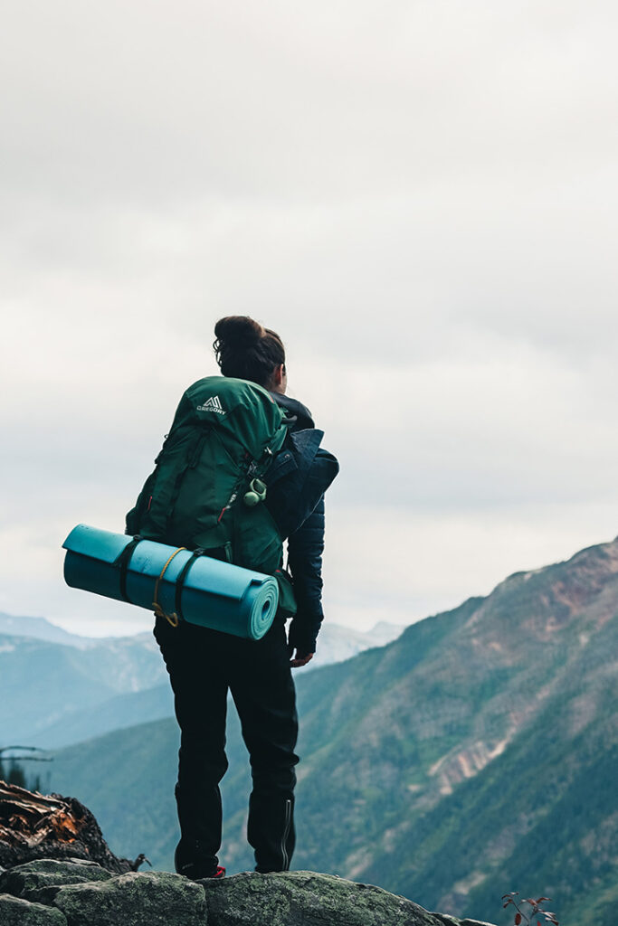 11 Hiking Safety Tips for Your Next Trail Adventure 4 A hiker walks on a trail through the mountains