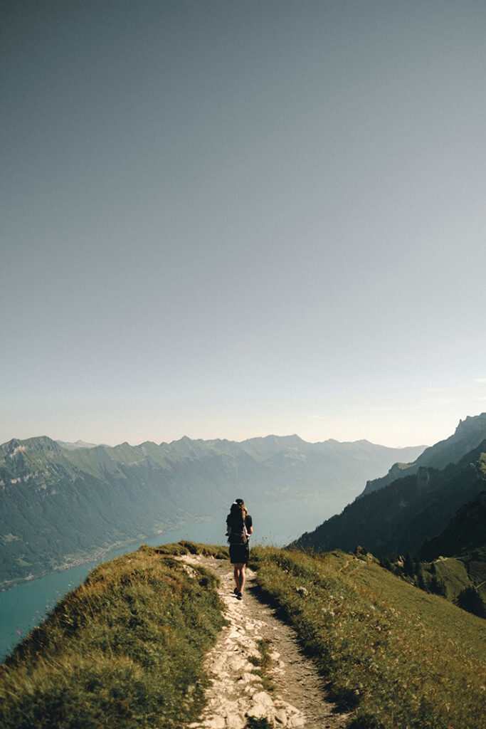 11 Hiking Safety Tips for Your Next Trail Adventure 22 A hiker walks on a trail through the mountains
