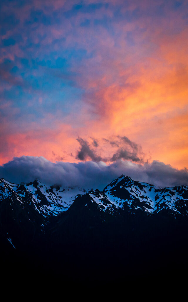 Olympic National Park Camping Guide: Everything You Need to Know About All 15 Olympic National Park Campgrounds 6 A purple and orange sunset above snow-covered mountains