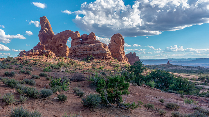 Ultimate Guide to an Epic One Day in Arches National Park Itinerary 31 A large red sandstone arch on a partly cloudy day