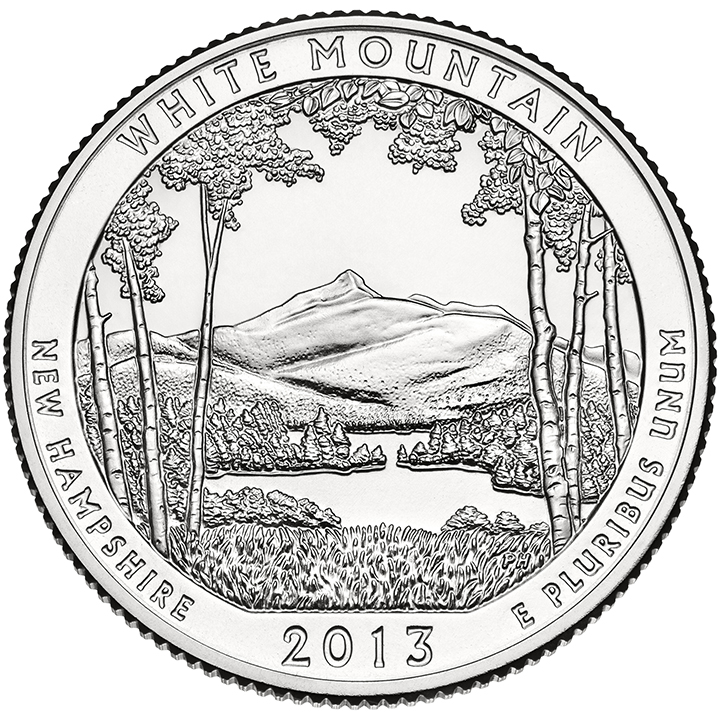 56 National Park Quarters List (With Pictures!) 35 A national park quarter for White Mountain with a serene lake surrounded by trees and a tall mountain in the distance