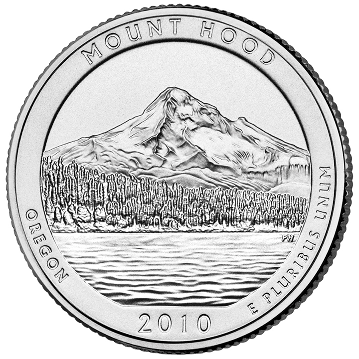 56 National Park Quarters List (With Pictures!) 44 A national park quarter for Mount Hood with a tall mountain towering above trees and a lake