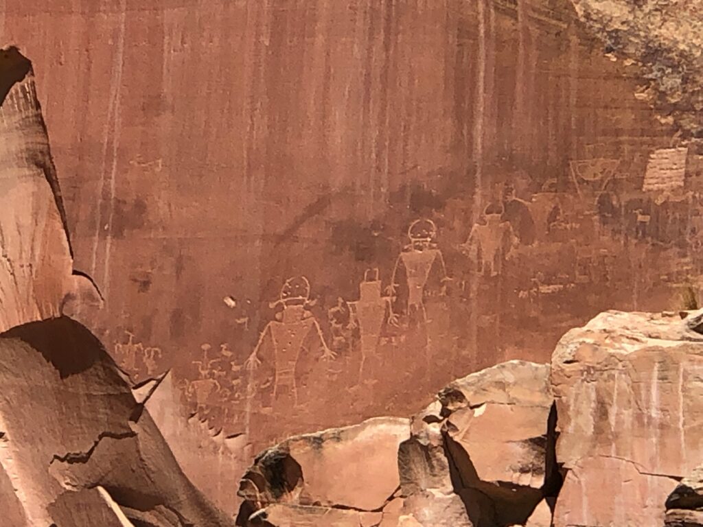20 Best Hikes in Capitol Reef National Park 38 Ancient hand-drawn pictographs on a sandstone wall