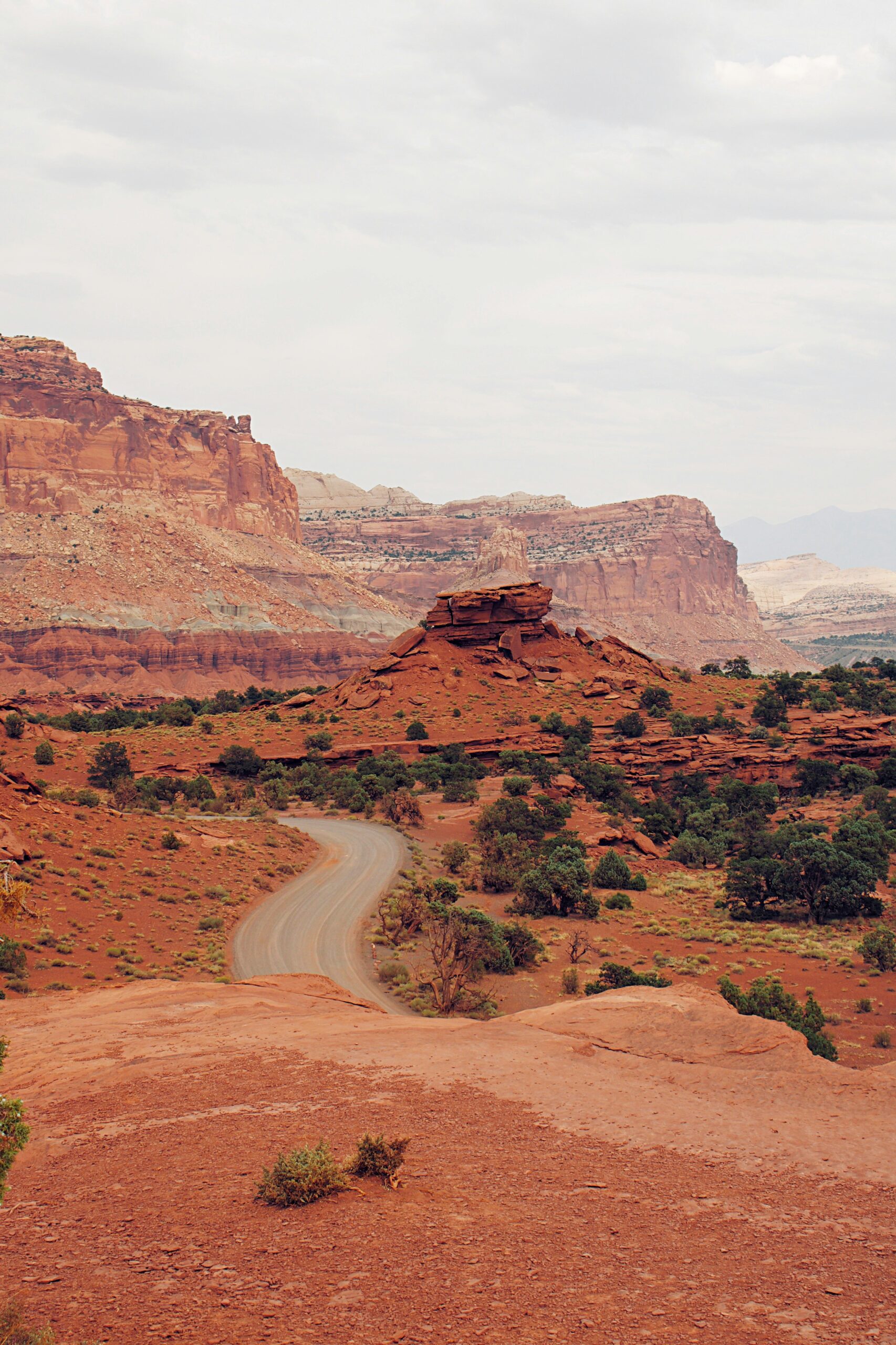 Capitol Reef National Park 5 A paved road winds through scenic orange geologic formations on a cloudy day