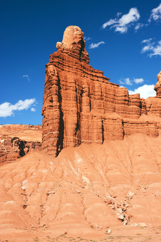 20 Best Hikes in Capitol Reef National Park 32 A large orange stone monolith resembling a chimney