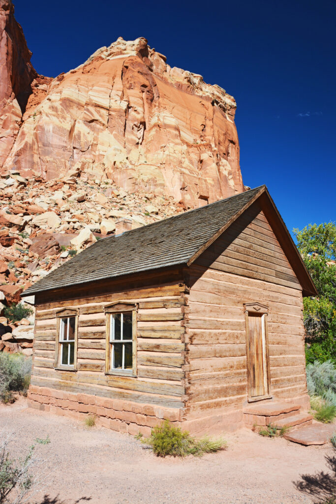 20 Best Hikes in Capitol Reef National Park 39 A wooden building below a rock formation