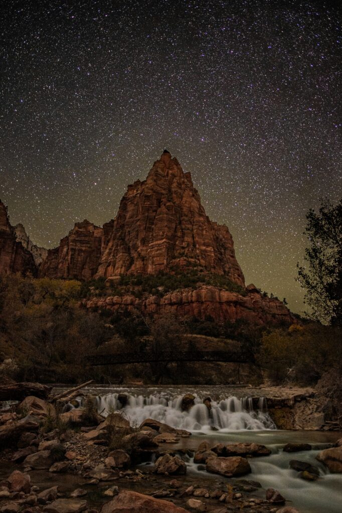Closest Airports to Zion National Park: How to Get to Zion National Park, Utah 2 A starry night above a pyramid-shaped rock formation