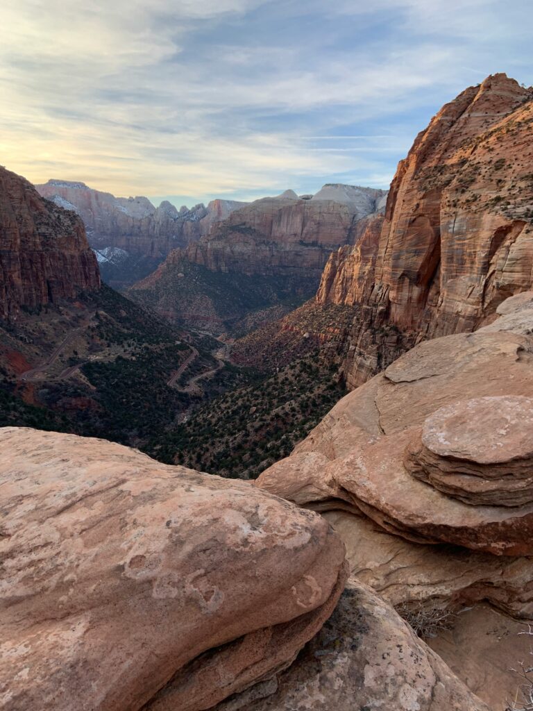 Closest Airports to Zion National Park: How to Get to Zion National Park, Utah 6 Flat rocks in the foreground with an impressive canyon view in the background