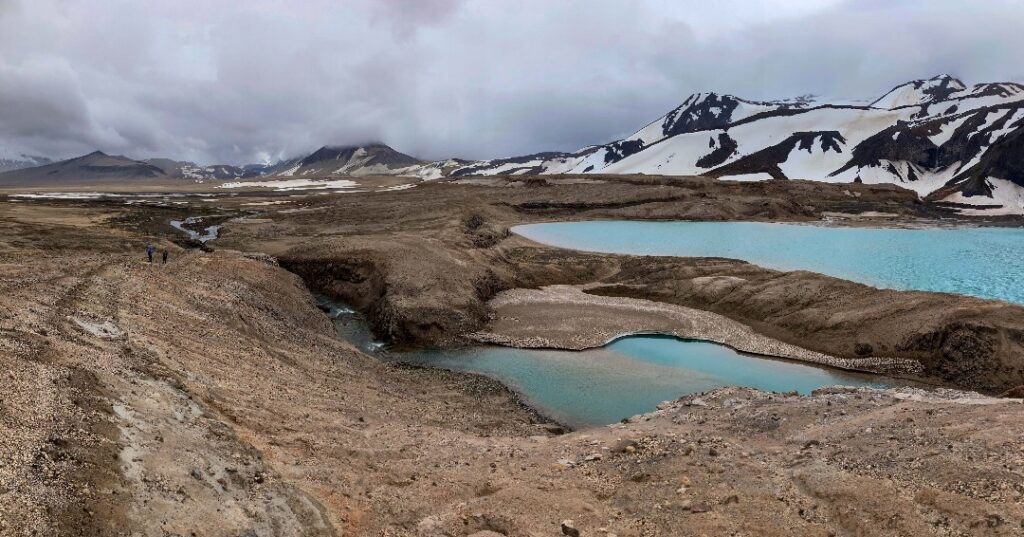 Where to Stay in Katmai National Park: Lodging, Campgrounds, and Backpacking 22 Two light blue ponds in an otherwise barren, brown landscape
