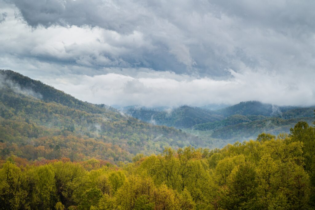 Everything You Need to Know About the Great Smoky Mountains National Park Parking Tags 1 Clouds rolling in over mountains with fall foliage